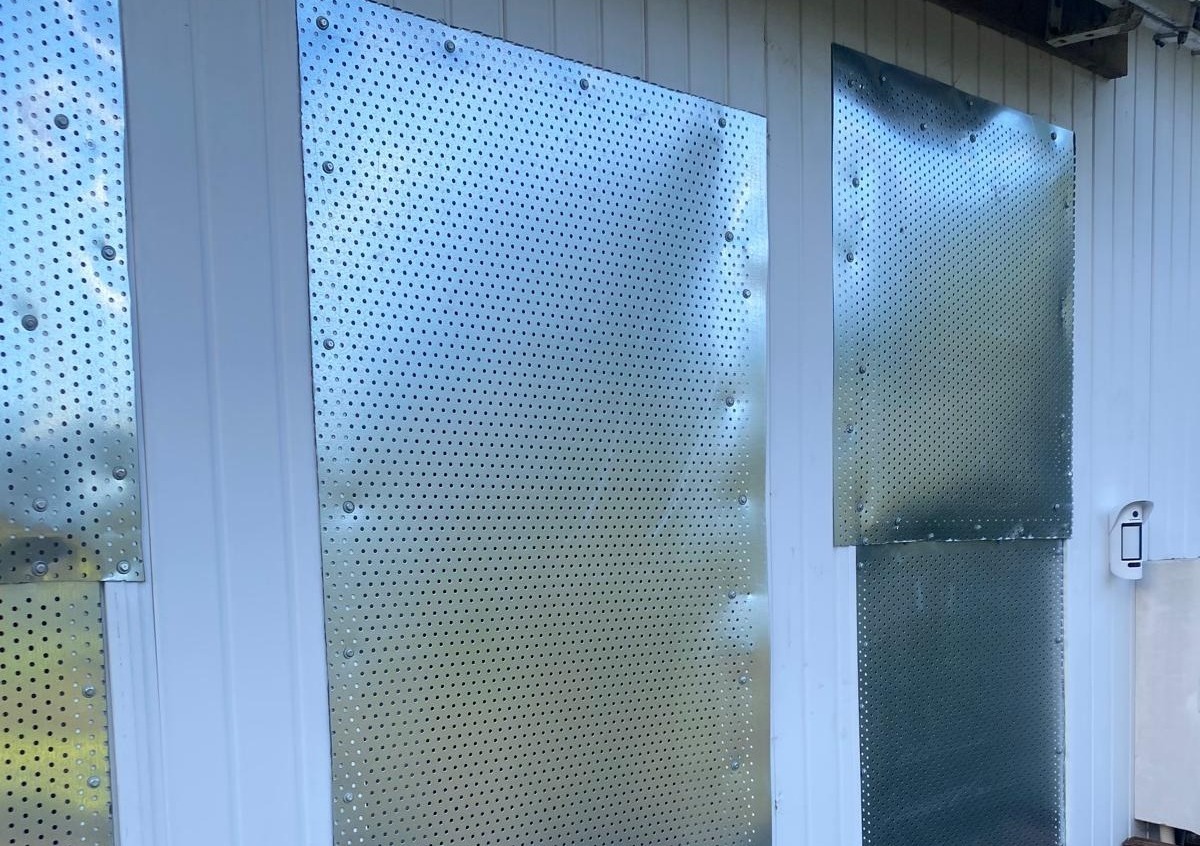 Vacant site protected with temporary metal screens